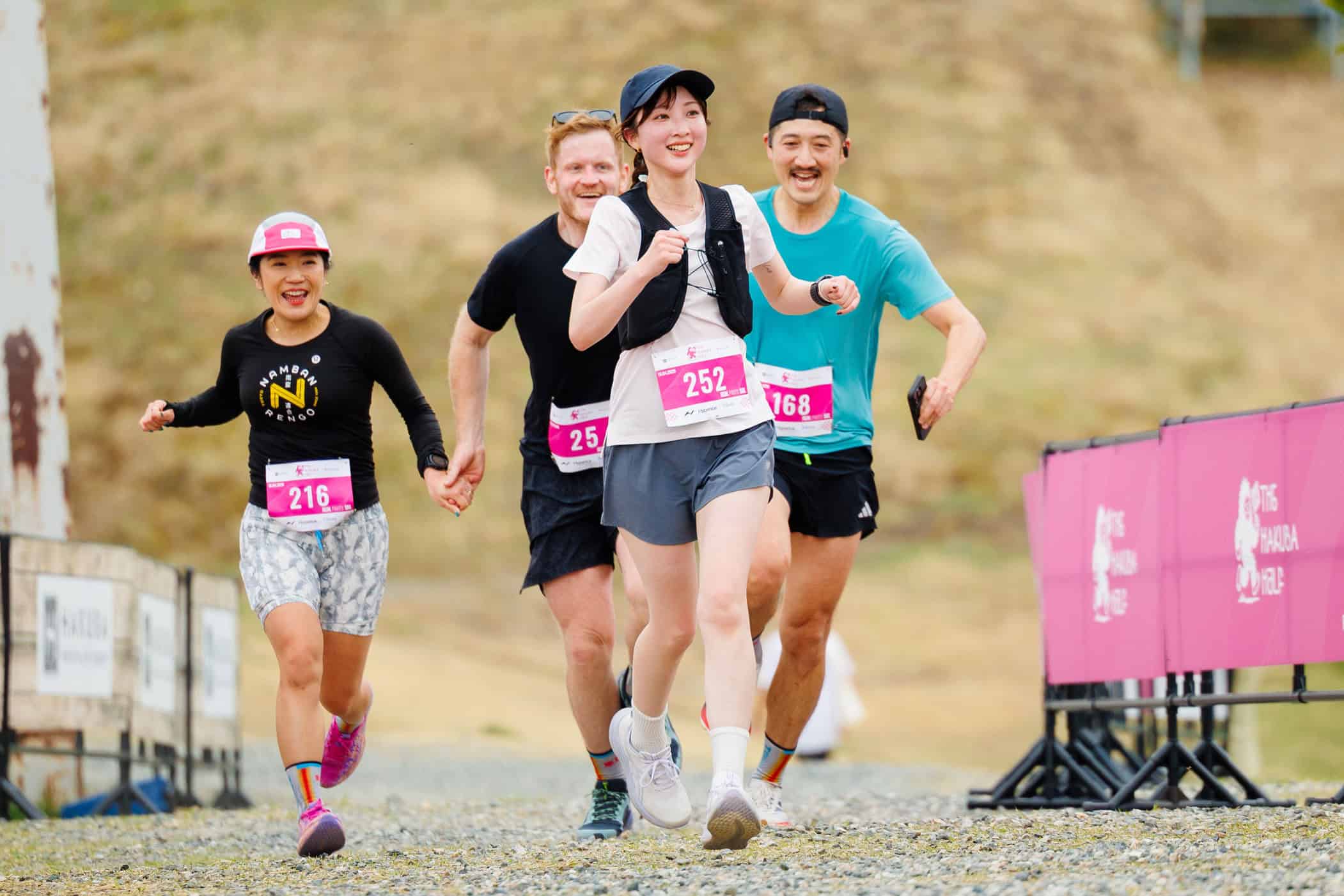 Participants finishing the Hakuba Half Marathon with smiles on their faces